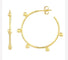 A pair of 14k yellow gold small beaded wire post hoop earrings.