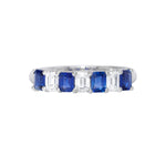 A platinum band ring with alternating blue sapphire and clear diamond stones.