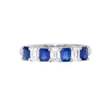 A platinum band ring with alternating blue sapphire and clear diamond stones.
