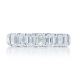 A platinum emerald cut diamond band with nine stones, displayed against a white background.