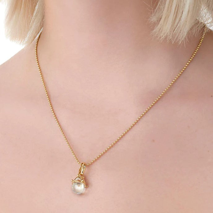 Woman wearing Temple St Clair 18K yellow gold Granulted Amulet